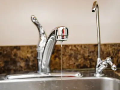 pouring water into glass